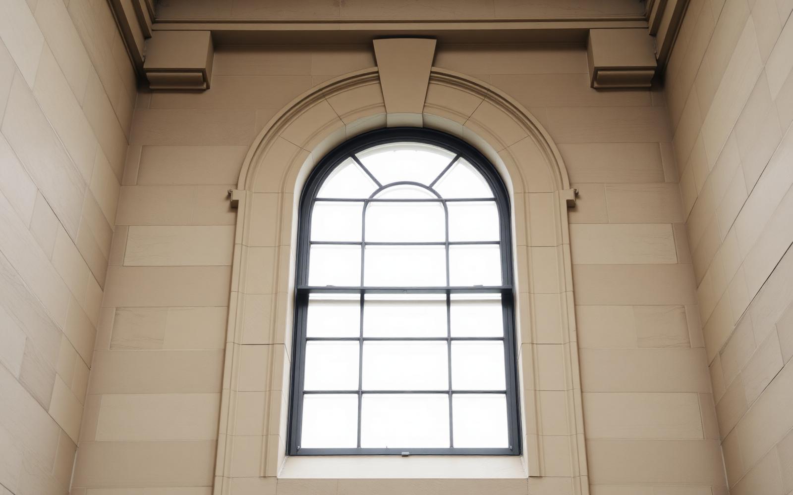 Arched stone window in a stately London building
